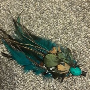 A peacock feather hair clip